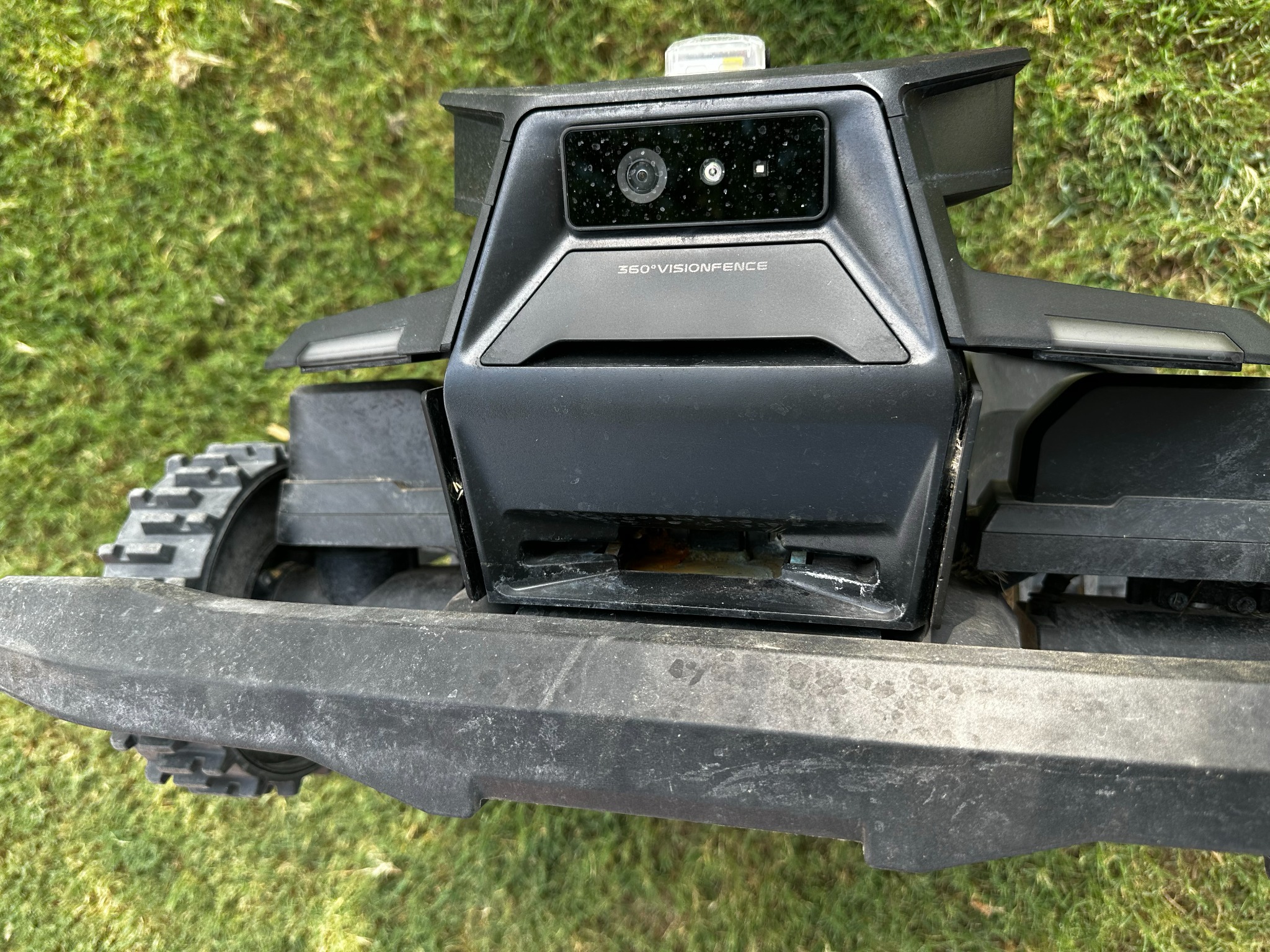 Navimow X430 charging area showing standing water and buildup inside the front charging cavity