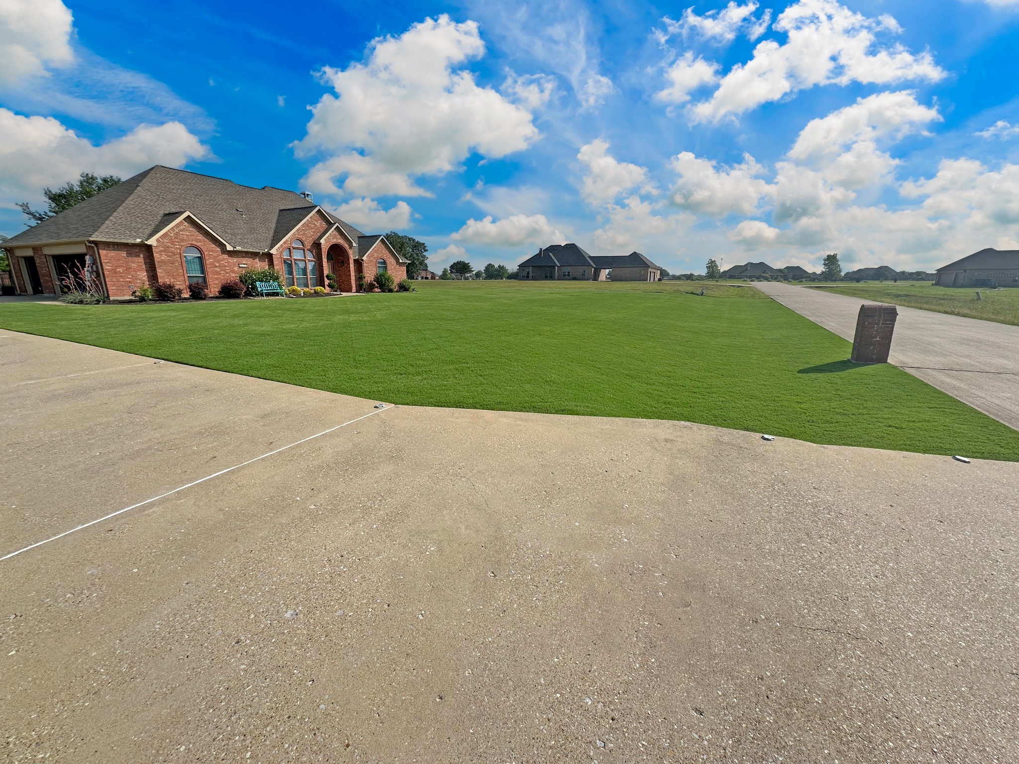 Lawn and Order Texas Edition front Bermuda lawn and home
