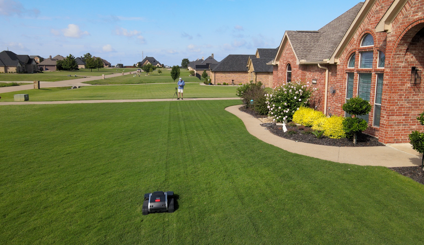 Front Bermuda lawn with robotic mower in use
